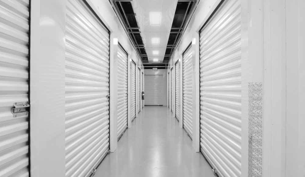 A commercial roll-up door in a storage corridor.